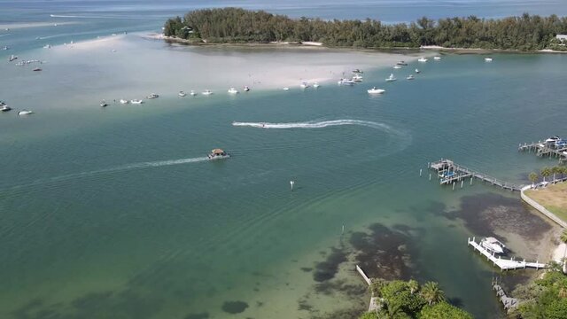 Timelapse of boaters enjoying the weekend in Sarasota, Florida and Jewfish Key.  A popular weekend sand bar party spot