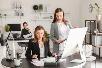 Female accountants working in office