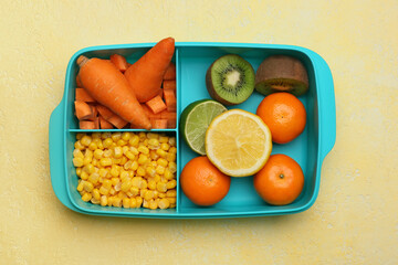 Lunchbox with tasty food on color background