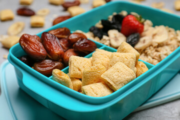 Lunchbox with tasty food on light background