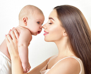 Mother and baby playing and smiling. Happy family.