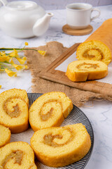 Delicious swill roll, roll cake or bolu gulung with pineapple jam 

Bolu Gulung is a sponge cake that is baked using a shallow pan, filled with jam or butter cream and then rolled. 