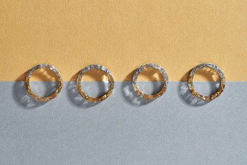 Transparent plastic rings with golden and silver filling