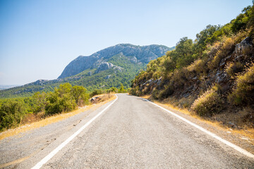 Fototapeta premium A picturesque narrow paved road in the Termessos National Park, Turkey.