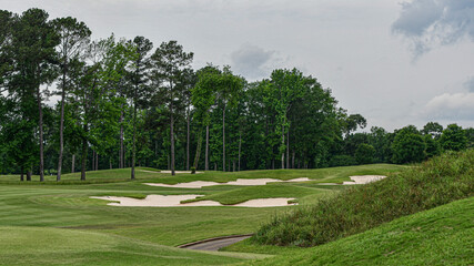 Landscape of golf course with sand traps