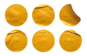 Naklejka premium Blank golden round adhesive paper sticker label set isolated on white background