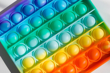 Colorful rainbow anti-stress fidget push pop it sensory toys for children. Simple dimple. 