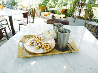 Plate of belgian waffles with ice cream