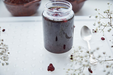 Fermented honey product with cranberry. Healthful food preparing before Christmas. Family recipe traditions. Healthy, sustainable, lacto-fermentation product with bacteria. Delicious recipe. Mead on