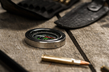 Hunting equipment on old dark wooden background
