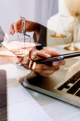 justice and law concept.Male judge in a courtroom on wooden table and Counselor or Male lawyer working in office. Legal law, advice and justice concept.