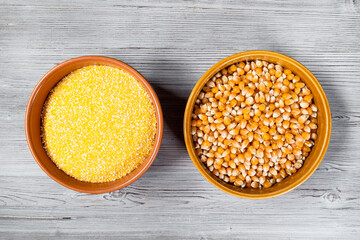corn seeds and cornmeal in round ceramic bowls