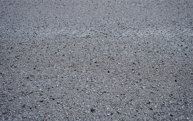 New asphalt road background with selective focus