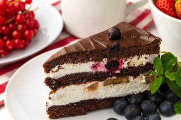 Piece of chocolate cake on table close up