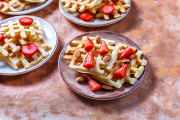 Homemade belgian waffles with strawberries.