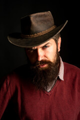 Fototapeta na wymiar Cowboy fashion. American West Style. Wild west rodeo. Man in Leather Cowboy Hat.