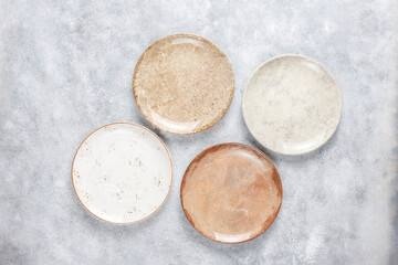 Different ceramic empty plates and bowls.