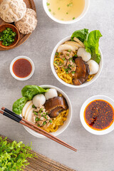 Bak chor mee. The noodles are tossed in vinegar, minced meat, pork slices, pork liver, stewed sliced mushrooms, meat balls and bits of deep-fried lard