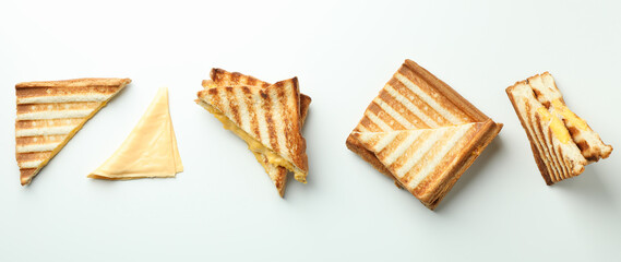 Grilled sandwiches with cheese on white background