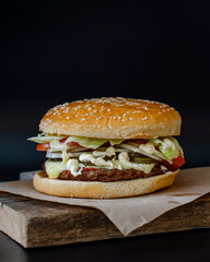 Burgers, hamburgers are delicious buns with cutlet, vegetables and sauce. Fast and tasty food.