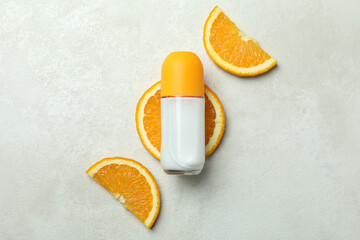 Blank orange deodorant on white textured background