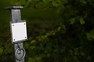 metal post with blank white sign