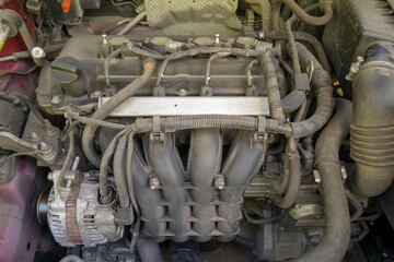 the engine of not a new passenger car. dust motor. space under the hood