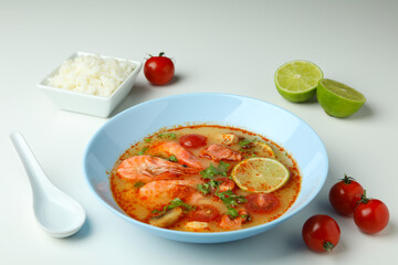 Tom yum soup and ingredients on white background