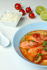 Tom yum soup and ingredients on white background