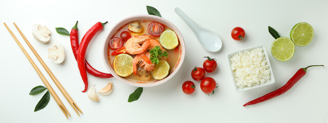 Tom yum soup and ingredients on white background