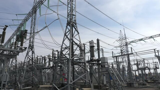 Power transmission lines on supports with ceramic insulators and transformers at large electrical distribution substation