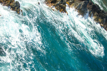 Wave hit the rock at beach, sea water splash at sea. Seascape. Splashes from the waves bumping against the rocky shore.