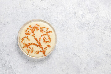 Azerbaijani firni sweet dessert with cinnamon powder.
