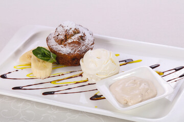 Tasty hot muffin with ice cream