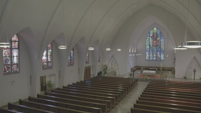 Camera pans to the chancel of the empty church of St. Konrad and Elisabeth in Freiburg, Germany