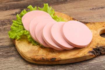 Sliced sausage snak over board