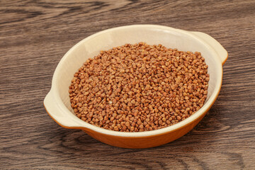 Raw buсkwheat cereal in the bowl