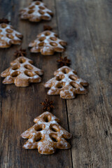 Christmas cookies in the shape of a Christmas tree. New Year's food. Anise star. Festive baked goods. Gingerbread on the table. Pattern