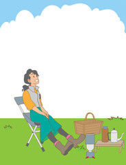 草原でピクニックをする日本人女性