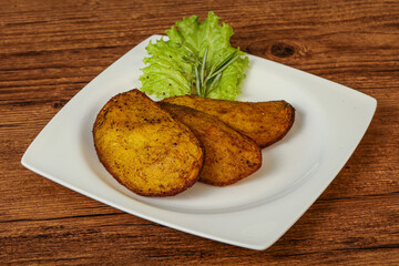 Baked potato with herbs and spices