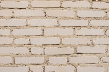 Weathered white stained old brick wall background