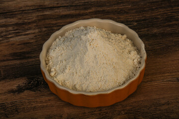 Wheat flour heap in the bowl