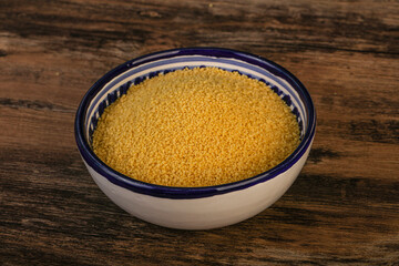 Raw cous cous heap in the bowl
