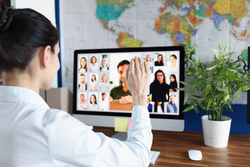 Employee is talking via video link with colleagues