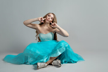 beautiful and daring princess in a lush blue Cinderella dress