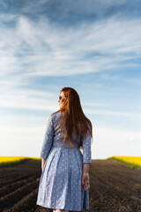 Pregnant woman on the summer field