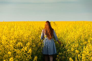Fototapeta premium Beautiful pregnant woman portrait on the agriculture field