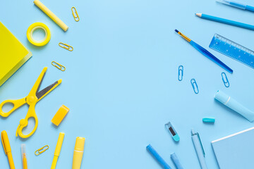 Back to School. School supplies and stationery on blue background. Education and studingc oncept. Banner. Top view, flat lay
