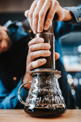 The process of brewing coffee close-up by hand - good morning with aromatic coffee