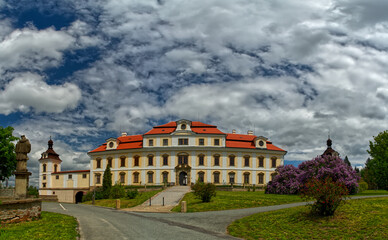 Fototapeta na wymiar Panorama of baroque palace “Rychnov nad Kneznou” in Czech Republic Europe with lilac flower